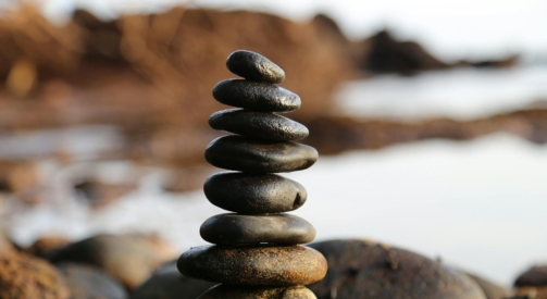 pile of rock near lake